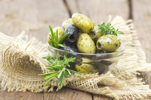 black and green olives marinated with garlic and fresh mediterranean herbs