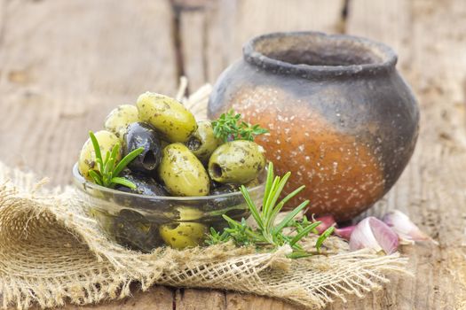 black and green olives marinated with garlic and fresh mediterranean herbs