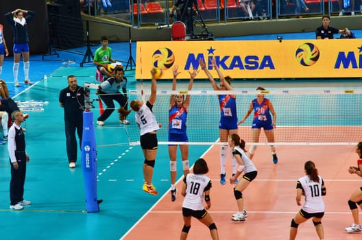 Bangkok, Thailand - July 3, 2015: Onuma Sittirak #6 of Thailand spikes during the FIVB Volleyball World Grand Prix Thailand and Serbia at Indoor Stadium Huamark on July 3, 2015 in Bangkok, Thailand.