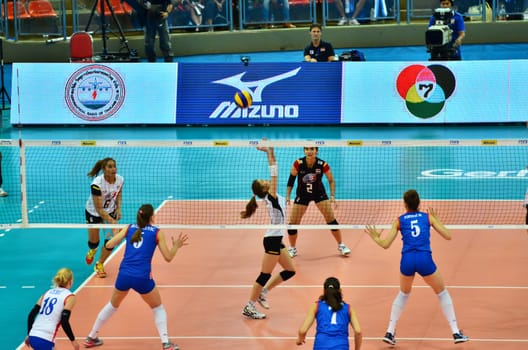 Bangkok, Thailand - July 3, 2015: Nootsara Tomkom #13 of Thailand setting up the ball during the FIVB Volleyball World Grand Prix Thailand and Serbia at Indoor Stadium Huamark on July 3, 2015 in Bangkok, Thailand.