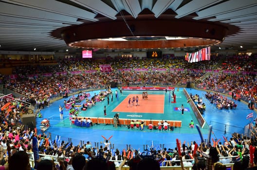 Bangkok, Thailand - July 3, 2015: Thai supporters at Indoor Stadium Huamark during the FIVB Volleyball World Grand Prix Thailand and Serbia on July 3, 2015 in Bangkok, Thailand.