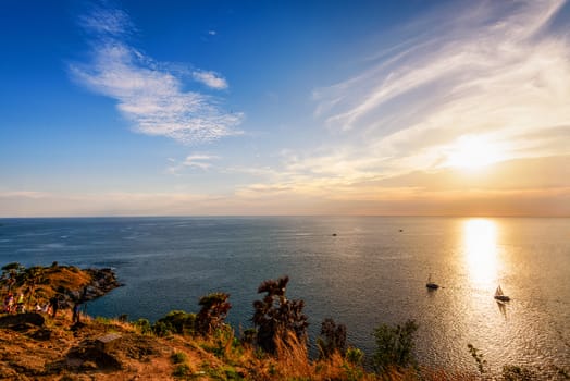 Colorful landscape beautiful sunset over the island and sea at Laem Phromthep Cape scenic point is a famous attractions of Phuket Province in Thailand