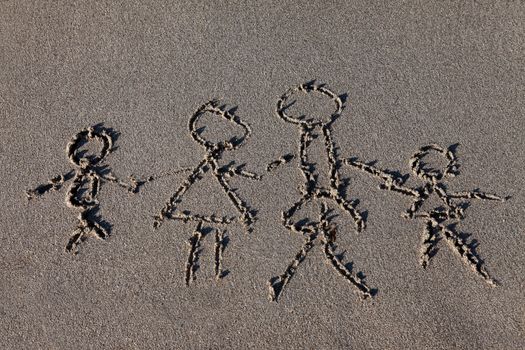 Children drawing in the sand