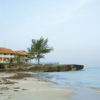 Rocky cliffs and beach of the ocean shore of a seaside resort