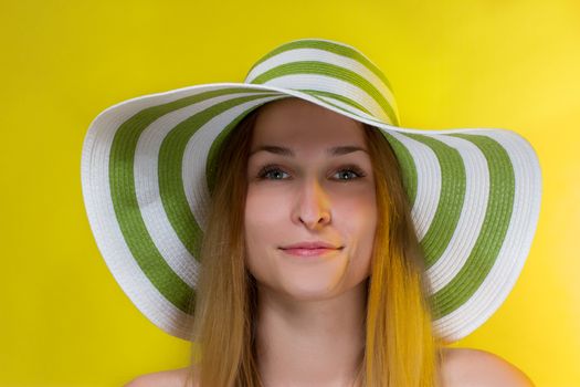 Portrait of pretty cheerful woman wearing straw hat 