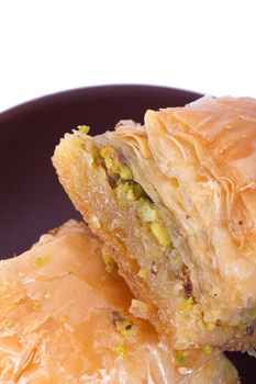 Close up detailed view of baklava with pistachio, delicious turkish dessert.