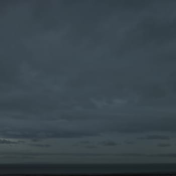 Dark cloudy sky over the ocean