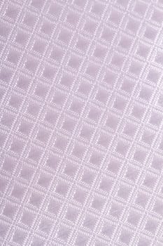 Close up detailed view of grey checkered fabric as background.