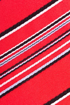 Close up detailed view of colorful striped fabric as background.