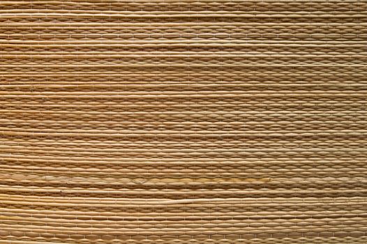 Thread woven mat hanging on the wall.