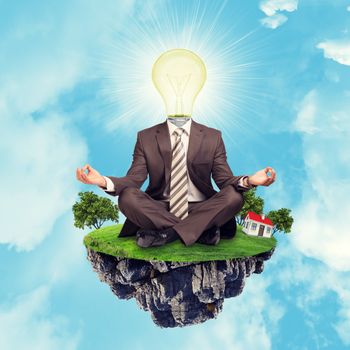 Businessman sitting in lotus posture with bulb instead head on island in sky, close-up view