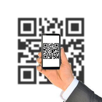 Businessmans hand showing smartphone with QR-code on isolated white background with code
