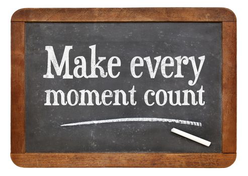 Make every moment count - white chalk text on a vintage slate blackboard