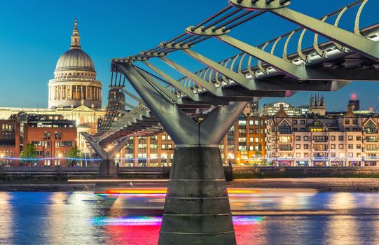 Millennium Bridge and St Paul Cathedral at dusk. Wonderful London summer skyline.