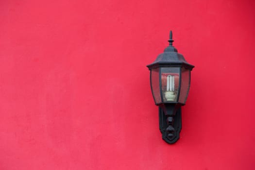 Lamp on cement wall background