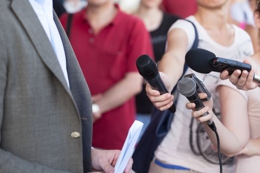 Journalist making interview with businessman or politician