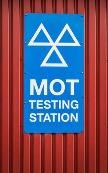 A Motor Ordinance Test (MOT) Station Sign At A Garage In The UK