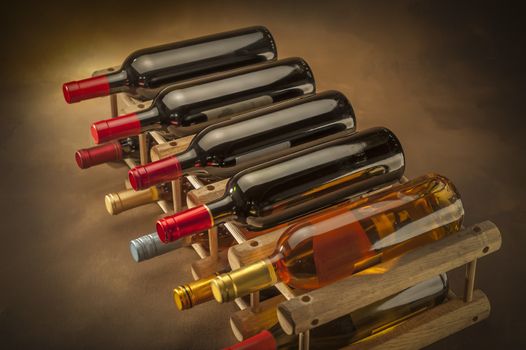 wine bottles stacked on wooden racks shot with limited depth of field