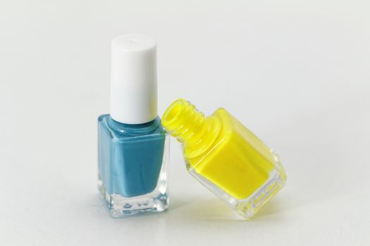 Colorful nail polish - white background, yellow and blue style