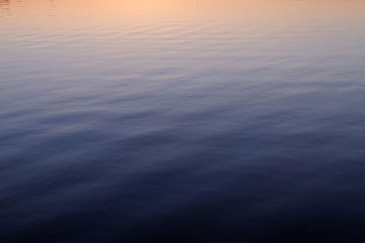 Photo of a calm lake in dusk 