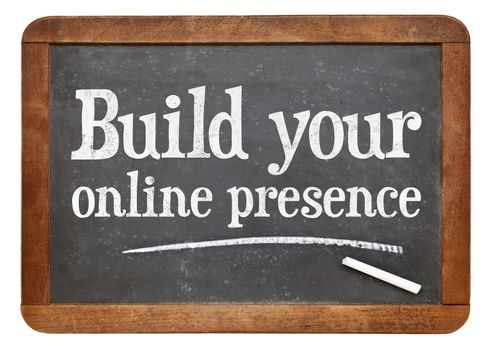 Build your online presence - internet marketing concept -  a text on a vintage slate blackboard