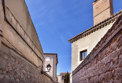 Avila Narrow City Streets Castle Walls Swallows Castile Spain.  Avila is described as the most 16th century town in Spain.  Walls created in 1088 after Christians conquer and take the city from the Moors  