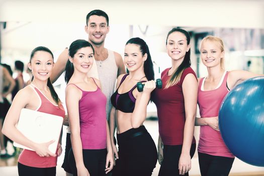 fitness, sport, training, gym and lifestyle concept - group of smiling people in the gym