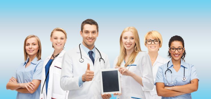 medicine, technology and healthcare concept - team or group of doctors and nurses with tablet pc computer blank screen showing thumbs up