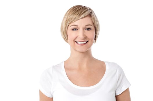 Middle aged woman posing to camera over white