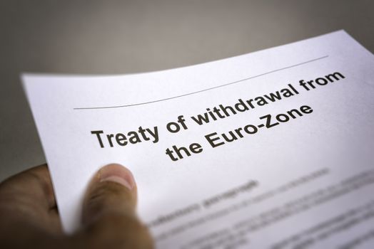 Man holding an treaty on the withdrawal from the euro zone in the hand