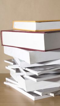 stack of book on wood table background