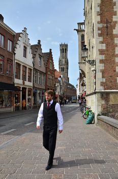 Bruges, Belgium - May 11, 2015: Belgian people in Bruges city on May 11, 2015. The historic city centre is a prominent World Heritage Site of UNESCO.