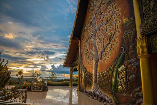 Art tree glow on the back of the hall of the temple in Thailand.