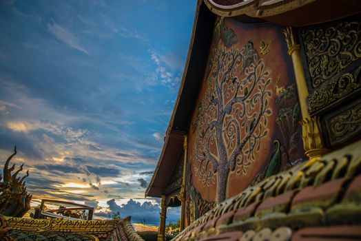 Art tree glow on the back of the hall of the temple in Thailand.
