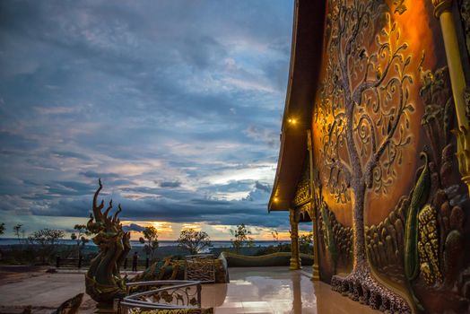 Art tree glow on the back of the hall of the temple in Thailand.