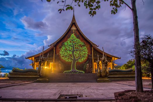Art tree glow on the back of the hall of the temple in Thailand.