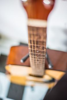 Focus on string classic wooden guitar.