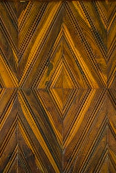Pattern squares on a wooden wall, Background.