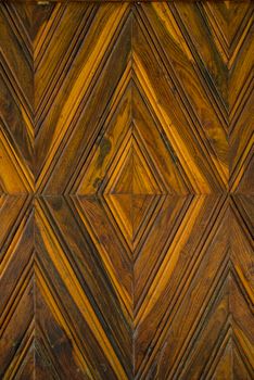 Pattern squares on a wooden wall, Background.