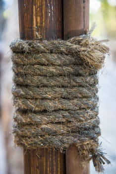 Hemp rope wrapped around the rods to seized the rods to the pole.