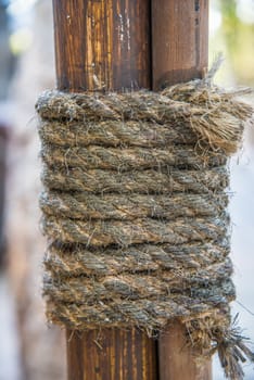 Hemp rope wrapped around the rods to seized the rods to the pole.