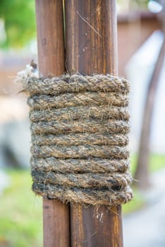Hemp rope wrapped around the rods to seized the rods to the pole.