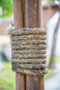 Hemp rope wrapped around the rods to seized the rods to the pole.