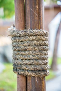 Hemp rope wrapped around the rods to seized the rods to the pole.