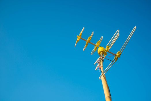 Antenna Television and blue sky background.