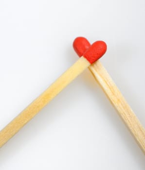 Conceptual Love from matches on white background