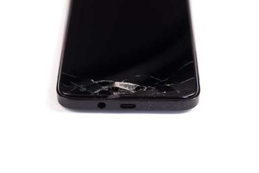Broken screen mobile phone black isolated on a white background.