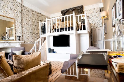 Spacious living room interior with hardwood floor.