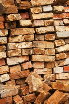  the piled old bricks of red color. were used for construction