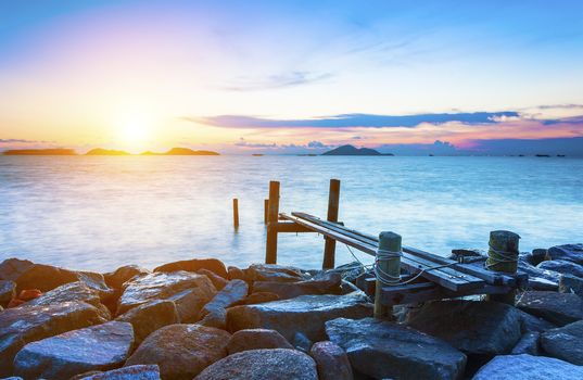 Pier over sunset waters